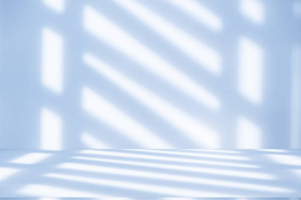 istock Studio style background wall decoration presentation uses white and blue tones. with shadows cast from a nearby window, concept creating a decorative 2168932675