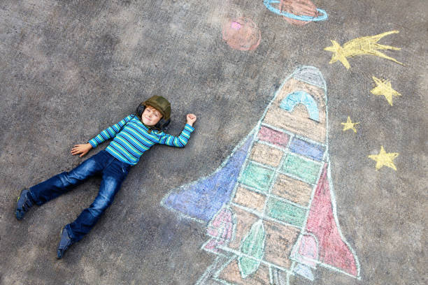 istock little kid boy flying by a space shuttle chalks picture 2168940023