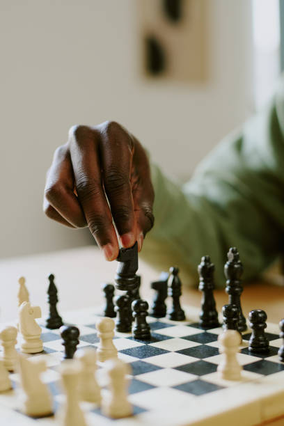 istock Unrecognizable Man Moving Knight Piece During Chess Game 2168942280
