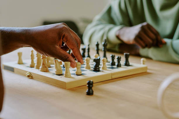 istock Male Hand Moving Chess Piece 2168942369