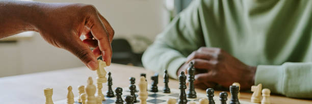 istock Unrecognizable Man Moving Knight Chess Piece Website Banner 2168942665