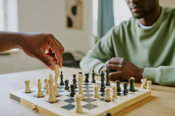 istock Unrecognizable Man Moving Knight Chess Piece 2168942967