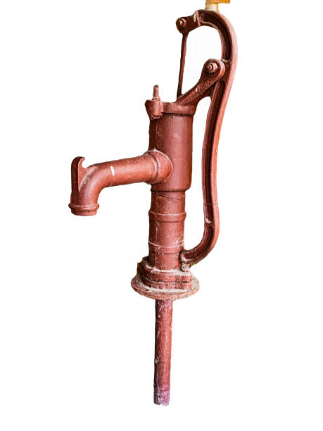 Old rusted manual water pump isolated on a white background