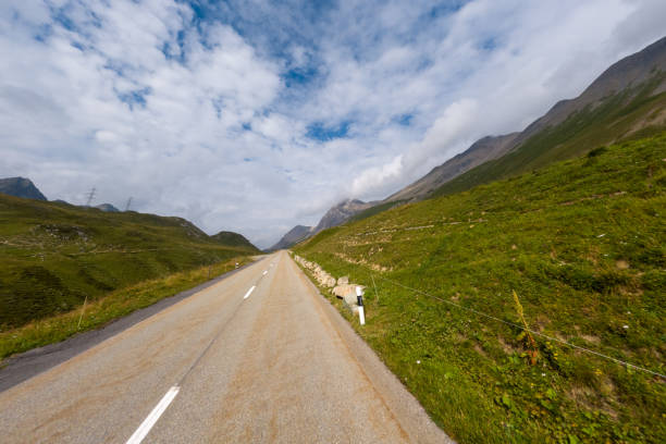 istock Empty Mountain Road Through Verdant Hills 2168944083