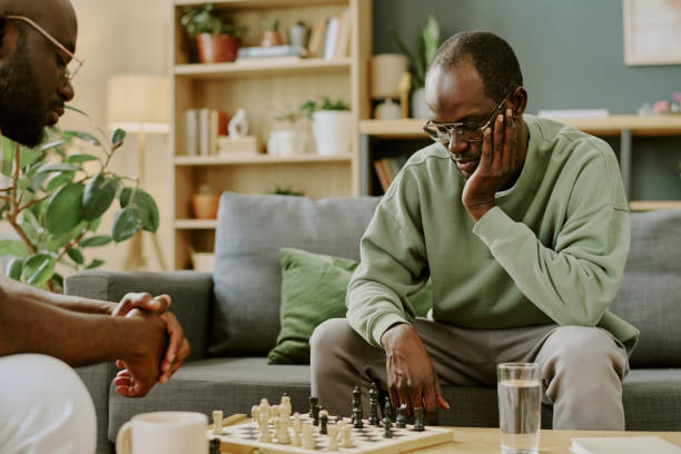 istock Man Thinking Of Strategy During Chess Game With Friend 2168944513