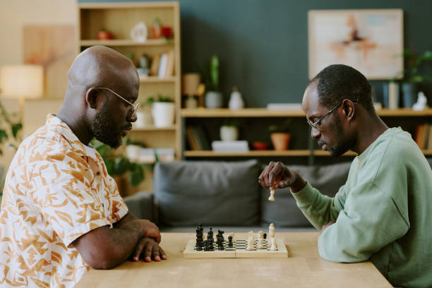istock African American Brothers Playing Chess 2168945145