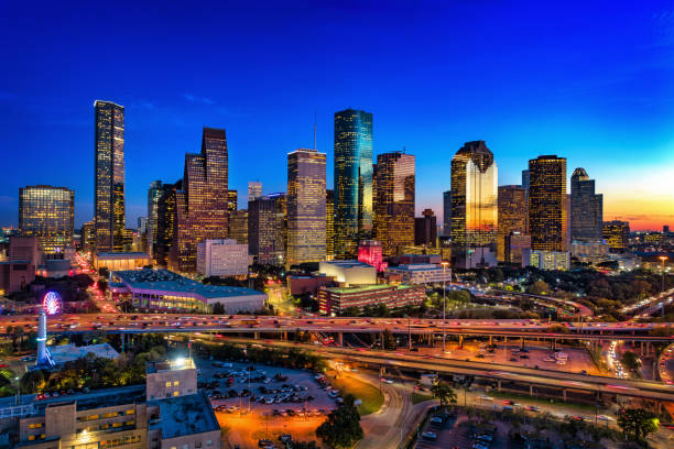 houston skyline aerial at dusk with freeway - houston-texas bildbanksfoton och bilder