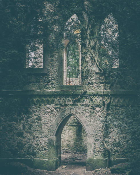 istock Lost Place, haunted overgrown gothic chapel in the forest 2168945833