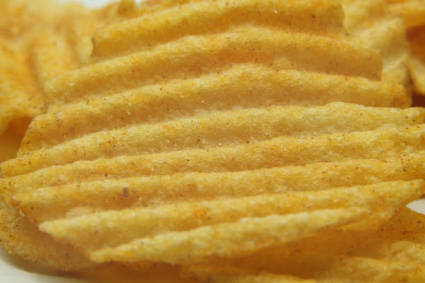Macro close up view of Potato chips. the texture of flavored and crispy on it