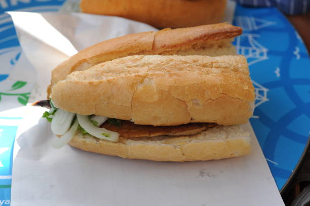 istock Fish sandwhich with grilled mackarel, raw onion in white wheat bread roll. Delicious taste. 2168951060