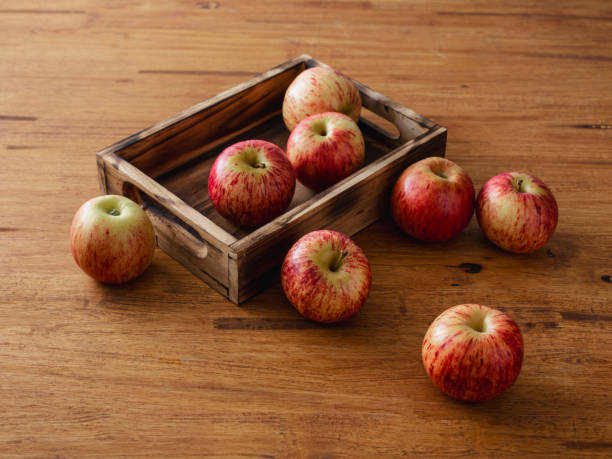 istock Fresh apples on a wooden background 2168952787