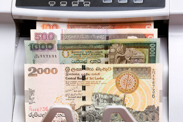 istock Old Sri Lankan rupee in the counting machine 2168955021