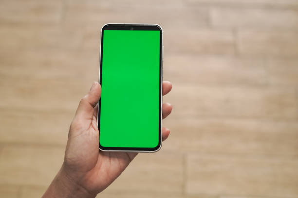 istock Hand Holding Green Screen Mobile Phone 2168956380