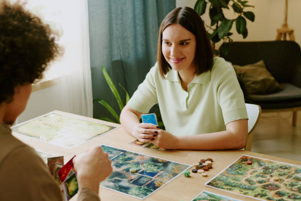istock Man And Woman Playing Board Game 2168956693