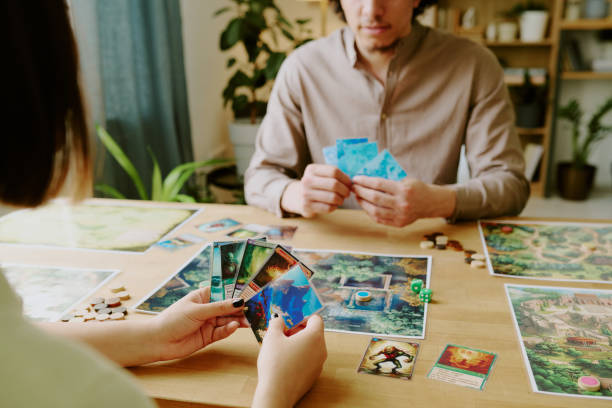 istock Man And Woman Playing Thematic Tabletop Game 2168958240