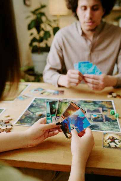 istock Unrecognizable Girl And Her Boyfriend Playing Board Game 2168958241