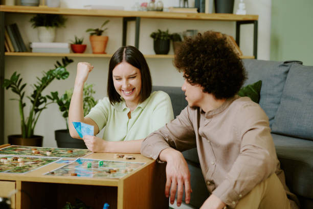 istock Young Woman Winning Board Game 2168959007