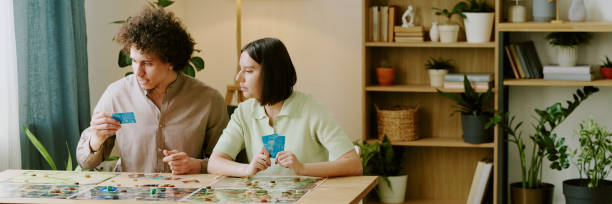 istock Gen Y Couple Playing Board Gamer At Home Website Header 2168959057