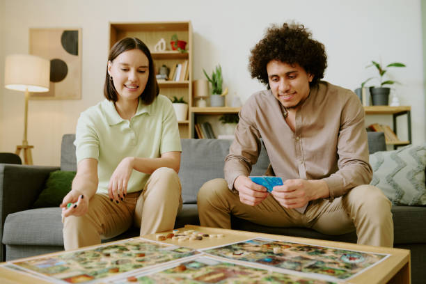 istock Happy Young Couple Playing Tabletop Game 2168960388