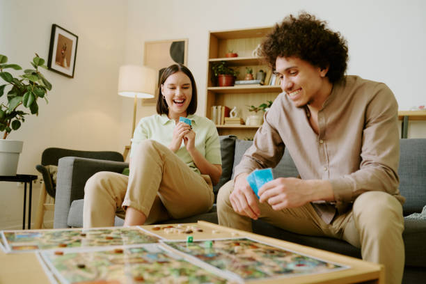 istock Couple Enjoying Playing Tabletop Game 2168960390