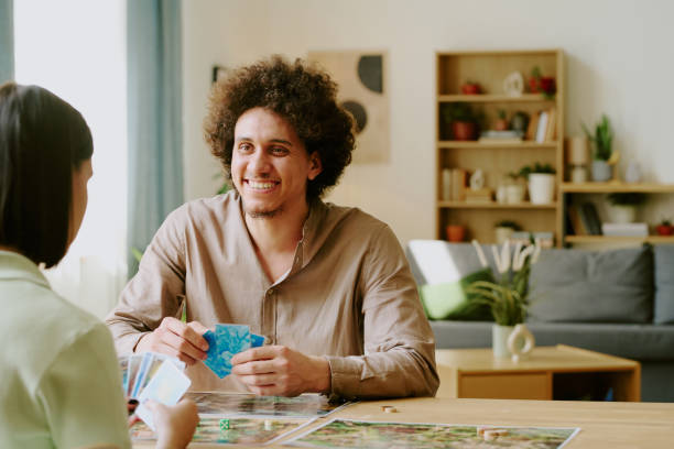 istock Man and his Girlfriend Playing Board Game 2168961587