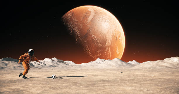 istock Astronaut On An Alien Planet Playing Soccer. Shooting Slowly. 2168967574