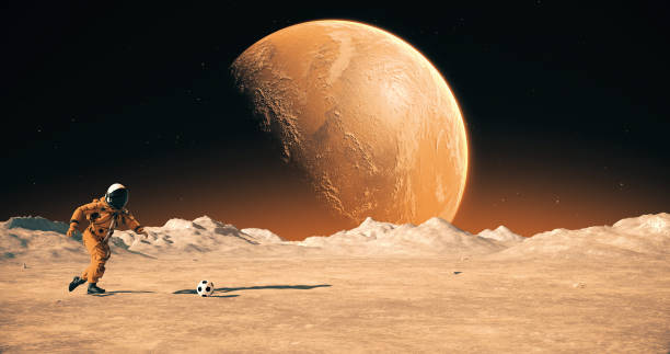 istock Astronaut On An Alien Empty Planet Playing Soccer. Shooting Slowly. 2168967585