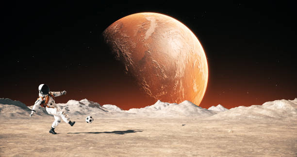 istock Astronaut On An Empty Planet Playing Soccer. Shooting Slowly. 2168967691