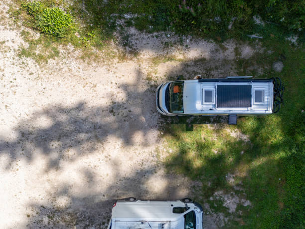 istock Top View of Campervans in a Forested Area 2168969860