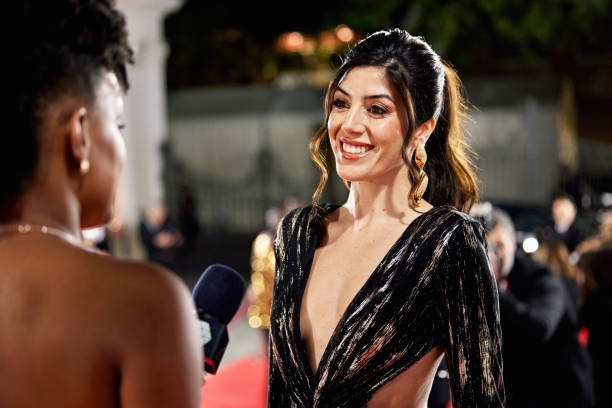 istock Brunette celebrity enjoying red carpet interview 2168970365