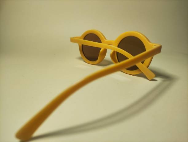 istock yellow glasses on a yellow background in photos from various sides 2168971010
