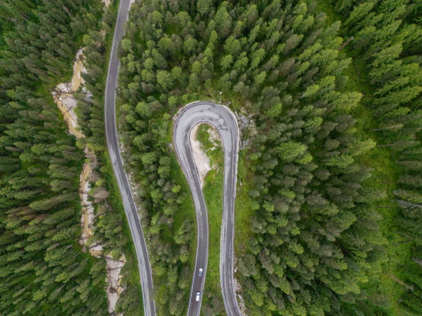 istock Hairpin Turn on Mountain Road Surrounded by Dense Forest 2168972781