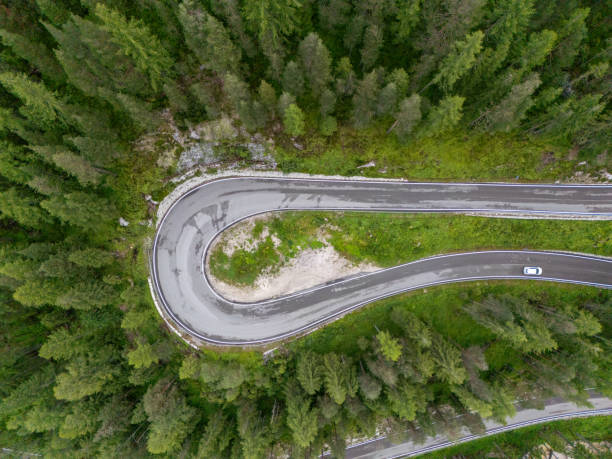 istock Hairpin Turn on Mountain Road Surrounded by Dense Forest 2168972844