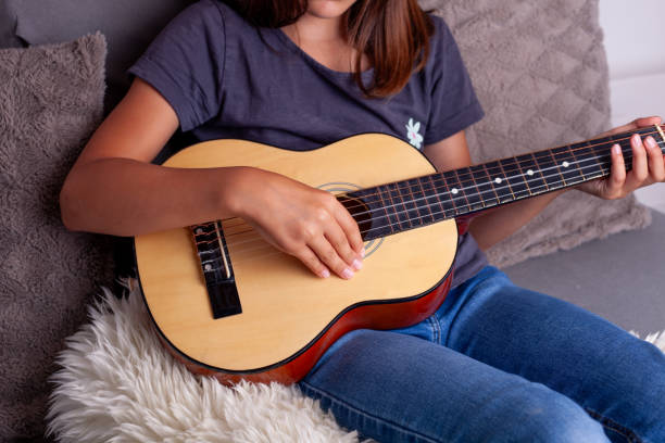 istock Young girl playing ukulele 2168973849