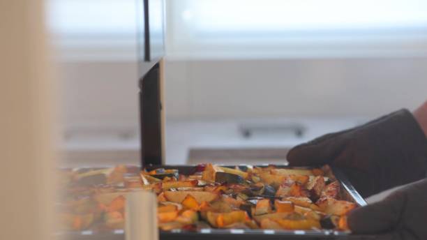 istock A Freshly Prepared Dish Being Carefully Placed into a Refrigerator for Proper Storage 2168974755