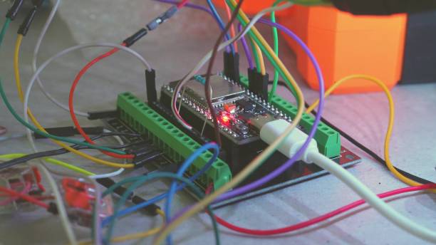 istock Closeup image of a detailed circuit board with various wires and electronic components 2168975132