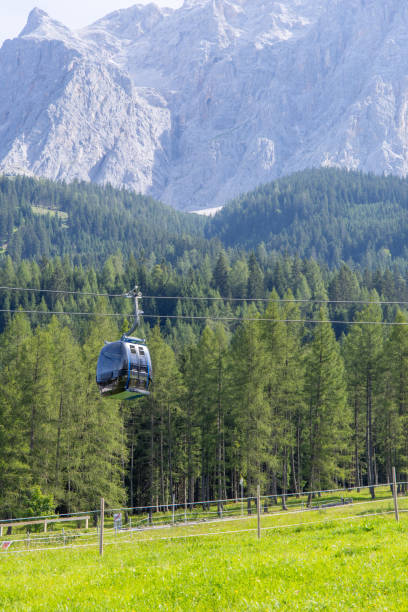 istock Cable Car Over Green Meadow with Forest and Mountains 2168975719