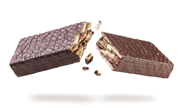 istock Chocolate covered wafer broken in half flying on white background. Isolated 2168975919