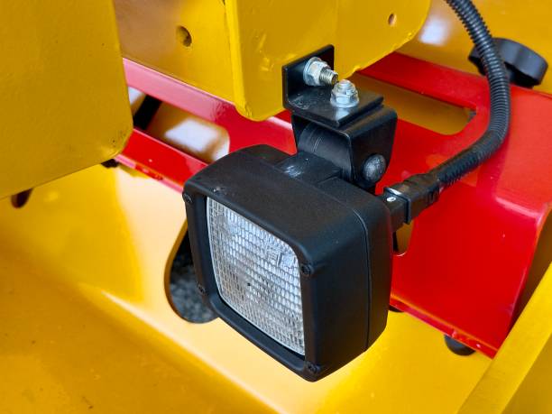 Heavy Duty Work Light: Close-up of a powerful, durable work light mounted on a heavy-duty machinery, ready to illuminate the job site.