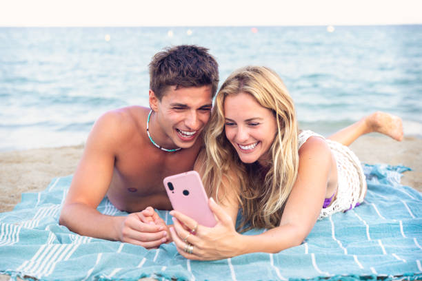 istock Young couple using smartphone app outdoors. 2168979691
