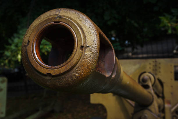 Barrel of an Soviet anti-tank gun. Artillery gun close up. Shallow depth of field (DOF).