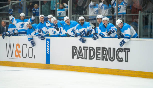 Ice Hockey Team Celebrating on the Bench