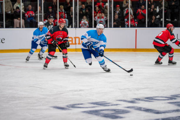 istock Ice Hockey Players in Action During a Competitive Game 2168982884