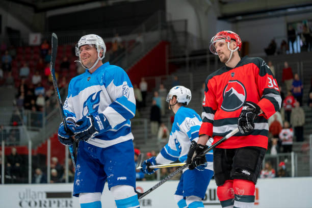 istock Smiling and Reflective Ice Hockey Players Post-Game 2168982903