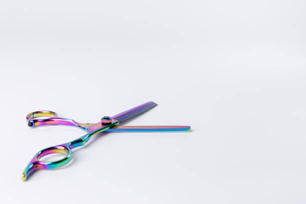 istock n open scissor displayed on the left side of a stark white background 2168982908