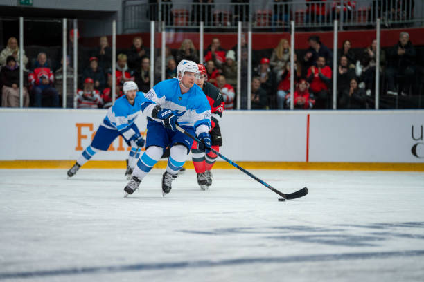 istock Focused Ice Hockey Player Controlling the Puck 2168982933