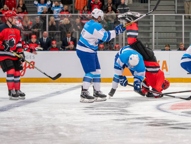 istock Ice Hockey Player Flipped Upside Down in Collision 2168982953