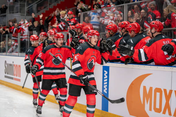 istock Hockey Players Celebrating on the Bench 2168983054
