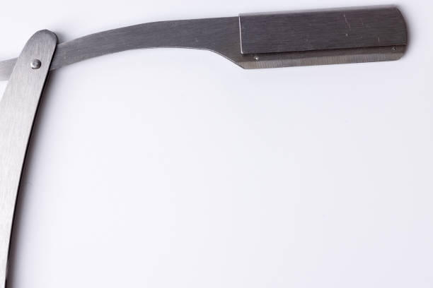istock op-down view of a polished open razor blade placed on a white background 2168983071