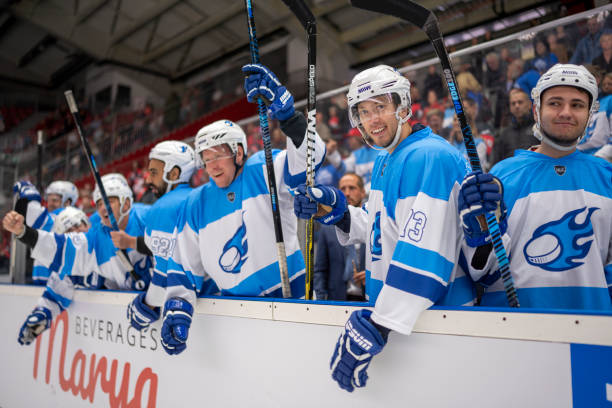 istock Cheerful Hockey Players on the Bench 2168983145